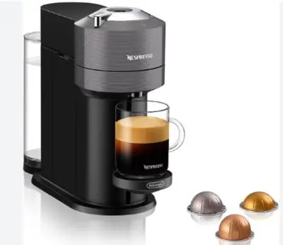 a black coffee maker with a cup of coffee at Villa ELISABETH in Aix-en-Provence
