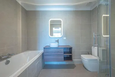 a bathroom with a tub and a toilet and a sink at VILLA VOGA- Luxury family holidays Aix-en-Provence in Éguilles