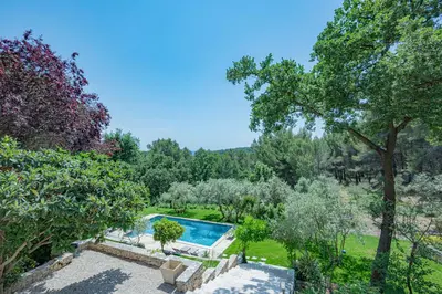 an aerial view of a garden with a swimming pool at VILLA VOGA- Luxury family holidays Aix-en-Provence in Éguilles