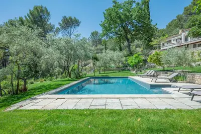 a swimming pool in the yard of a house at VILLA VOGA- Luxury family holidays Aix-en-Provence in Éguilles