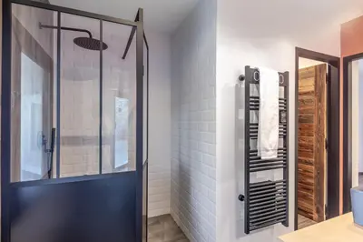 a bathroom with a shower and a glass door at Villa Feijoa en Provence in Velleron