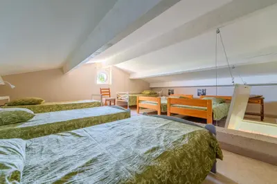 a large kitchen with wooden cabinets and a sink at Villa sur 1 hectare 15 Personnes GORDES & ROUSSILLON in Croagnes