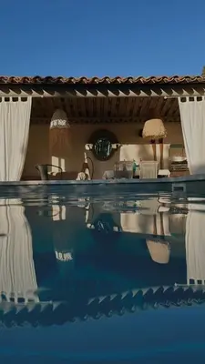 a house with a swimming pool in front of it at Appartement dans Mas Provencal in Grans