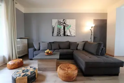 a living room with a couch and a table at Le Blondel in Aix-en-Provence
