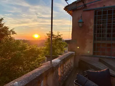 a sunset from the balcony of a house at La Villa Ocre Ménerbes in Ménerbes
