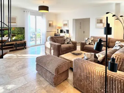 a living room with couches and a table at provence living in Roussillon