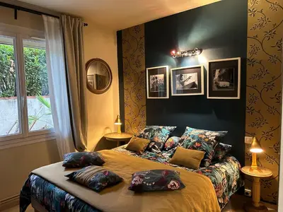 a bedroom with a bed with pillows on it at Nid d'Ange en Provence in Cavaillon