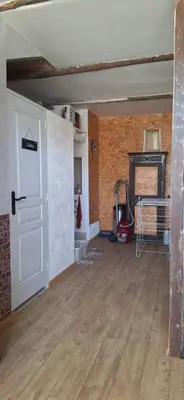 an empty room with a white door and a fireplace at Loft en duplex au Mas de la Restanque in Monteux