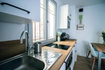 a kitchen with a sink and a counter top at Le constantinou in Saint-Michel-lʼObservatoire