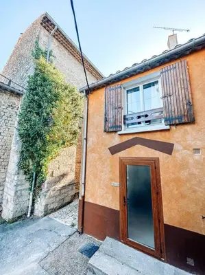 a building with a door and a window on it at Le constantinou in Saint-Michel-lʼObservatoire