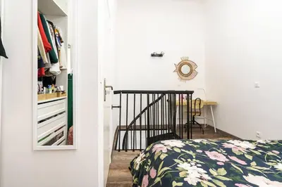 a bedroom with a bed and a closet at Duplex en plein centre historique Aix en provence in Aix-en-Provence