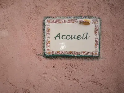 a sign on a wall with the word adventurer at GÎTE DE L 'OCRE NICE VIEW in Villars