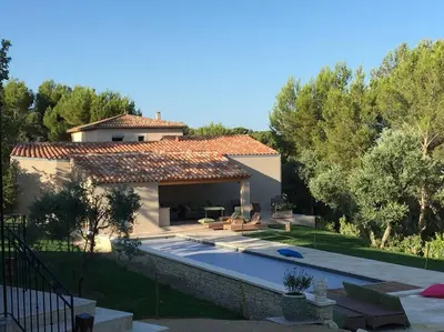a house with a swimming pool in a yard at Villa des Fontaines luxury family home with pool in Pernes-les-Fontaines