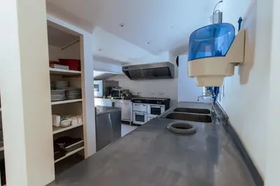 a kitchen with a sink and a counter top at Le Moulin de Lavon in Gargas