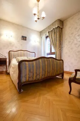 a bedroom with a large bed in a room at Le Jourdan clim' terrasse ascenseur garage in Aix-en-Provence
