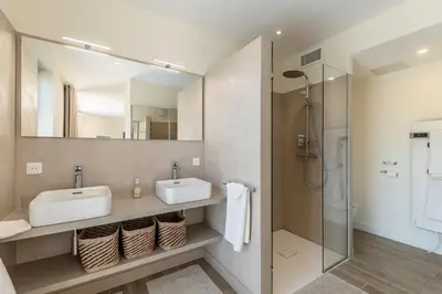 a bathroom with two sinks and a shower at Villa Mirage luxury and design in Bonnieux in Bonnieux