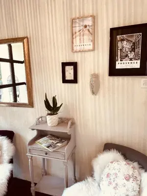 a room with a table with a potted plant on it at B&B Temps Suspendu Provence in Pernes-les-Fontaines