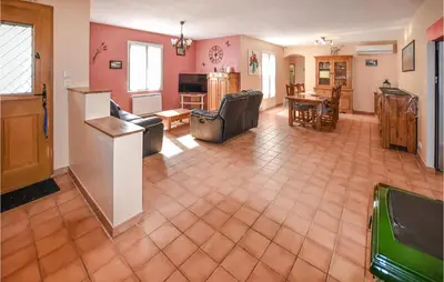 a living room with a kitchen and a dining room at Amazing Home In Mazan With Kitchen in Mazan