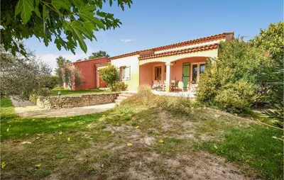 an external view of a house with a yard at Amazing Home In Mazan With Kitchen in Mazan