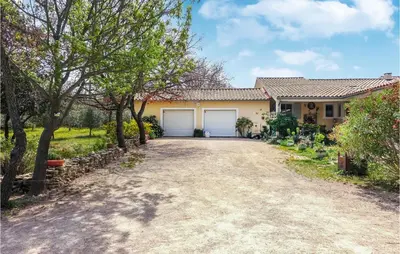 a house with a driveway in front of it at Nice Home In Venasque With Kitchen in Venasque