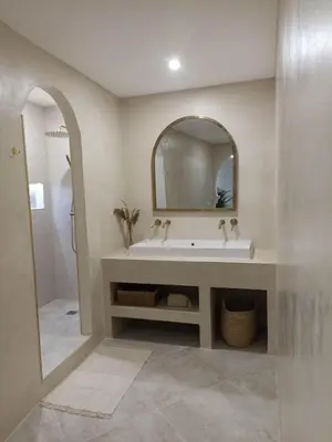 a bathroom with a sink and a mirror at La Suite du clocher in Noves