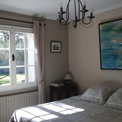 a bedroom with a bed and a window at Mas Grimaud - Gîte- Studio et chambres d'hôtes familiales in Eygalières