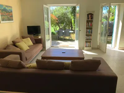 a living room with a couch and a table at Auberge de Mazan in Mazan