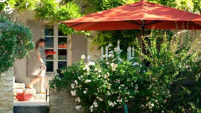 three sculptures in a garden with a water fountain at Mas de L'Amarine in Saint-Rémy-de-Provence