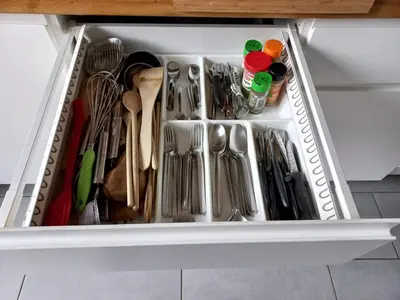 a white drawer filled with utensils in a kitchen at Aix en Provence - Rotonde - Cours Mirabeau in Aix-en-Provence