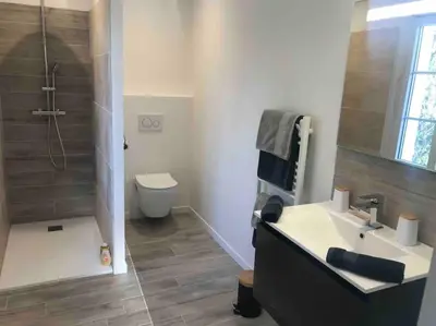 a bathroom with a sink and a shower and a toilet at Imola - Côté Ventoux in Bédoin