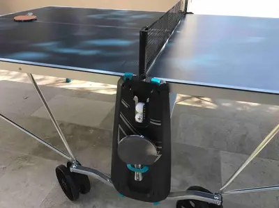 a ping pong table with a ping paddle on it at Imola - Côté Ventoux in Bédoin