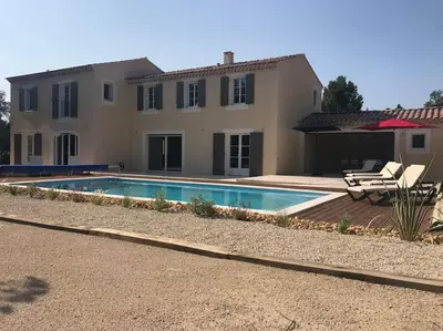 a house with a swimming pool in front of it at Imola - Côté Ventoux in Bédoin