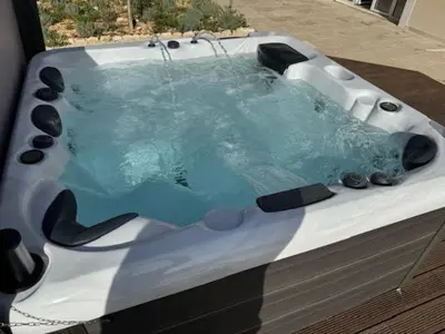 a jacuzzi tub with a water fountain at Imola - Côté Ventoux in Bédoin