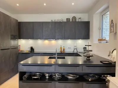 a kitchen with a sink and a counter top at Mas La Rose Sauvage - magnificent Luberon views in Murs