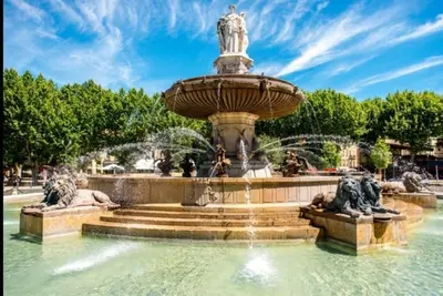 a fountain in a park with two statues at Les quatre loges n°1 in Aix-en-Provence
