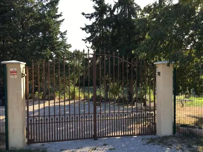 an iron gate with a large iron fence at FLC - Large Charming House - Swimming Pool in Lambesc
