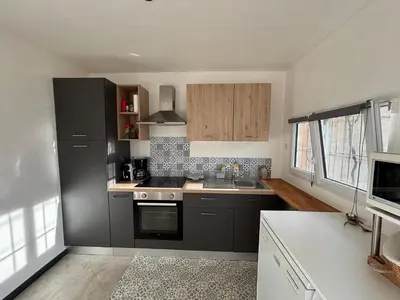 a kitchen with a sink and a stove top oven at 