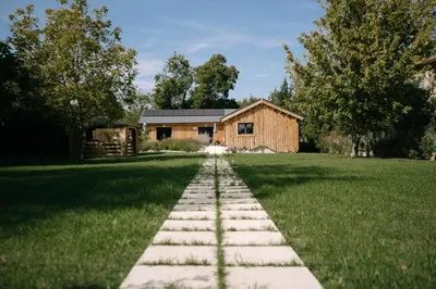 a stepping stone path in front of a house at Charming ecolodge with private access to the river in Le Thor