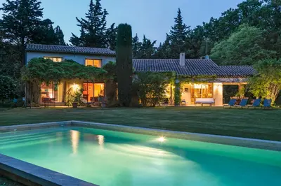 a house with a swimming pool in the yard at VillaOustal. Parc Arboré 4500 m2. Piscine chauffée. in Carpentras