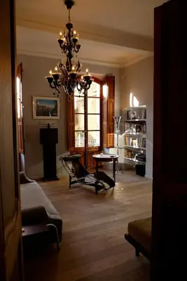 a living room with a chandelier and a table at Luxury two bedroom apartment in Apt, the heart of the Luberon in Apt