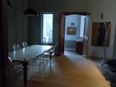 a dining room with a long table and chairs at Luxury two bedroom apartment in Apt, the heart of the Luberon in Apt