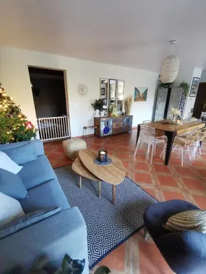 a large kitchen with wooden cabinets and black counter tops at Villa La Ressourcerie a Saignon in Saignon