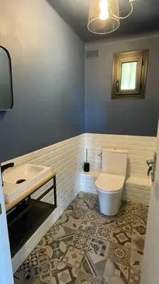 a bathroom with a toilet and a sink at LA VILLA 81 in Mormoiron