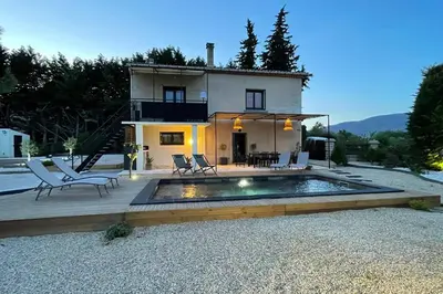 a house with a swimming pool in front of a house at LA VILLA 81 in Mormoiron