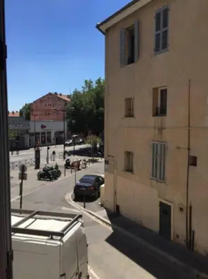 a view from a window of a street with a building at T3 centre ville Historique in Aix-en-Provence