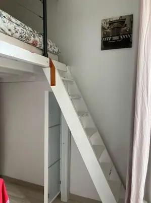 a white bunk bed with a ladder in a room at T3 centre ville Historique in Aix-en-Provence
