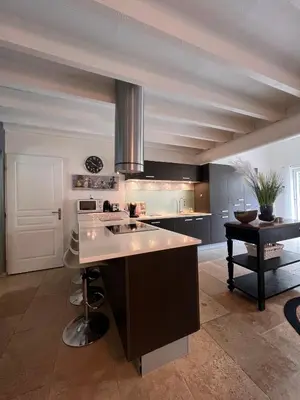 a kitchen with a large island in a room at Villa en Provence, Spa & piscine, pour 9 personnes- Gîtes les Estelles in Cavaillon
