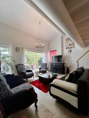 a living room with two couches and a fireplace at Villa en Provence, Spa & piscine, pour 9 personnes- Gîtes les Estelles in Cavaillon
