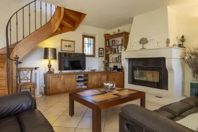 a living room with a couch and a fireplace at Mas de Lavande in Saint-Rémy-de-Provence