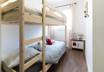 a bedroom with two bunk beds and a desk at Alma Viva - Piscine Privée - Climatisée - Parking in Velaux